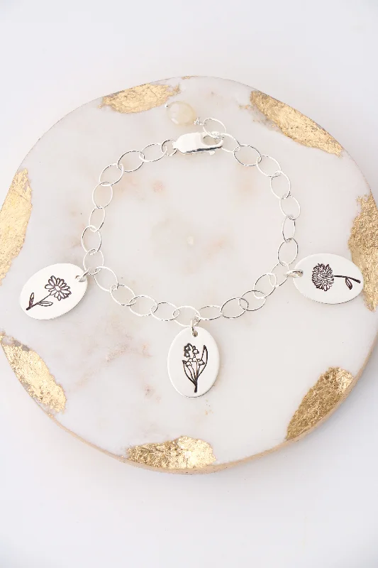 cubic zirconia ladies bracelets & bangles-birthflower bracelet {sterling silver}